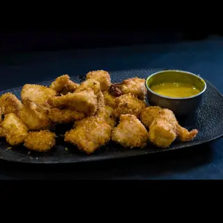 Delicias De Pollo Crocantis Y Salsa