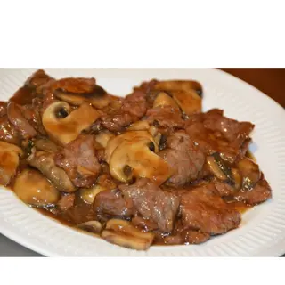 Ternera con champiñones