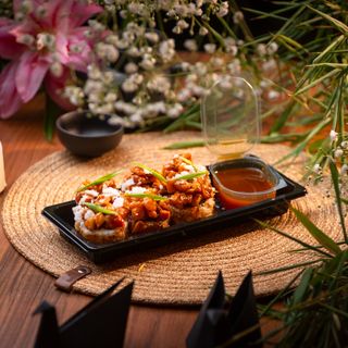 Roll with salmon and sea buckthorn-ginger sauce