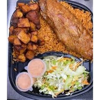 Special jollof rice served with turkey plantain and  salad 