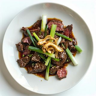 109 Manzo con zenzero e cipolline