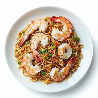 36 Spaghetti di riso saltati con frutti di mare