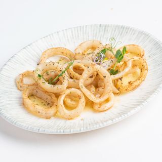 Калмари на плоча с билково масло (200 г.)