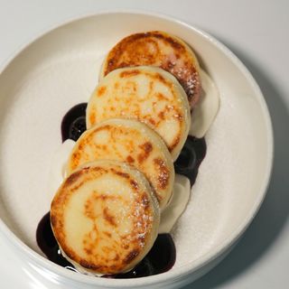 Syrniki with blueberry and sour cream