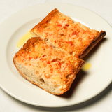 Pa de coca amb tomàquet i oli de l’Empordà