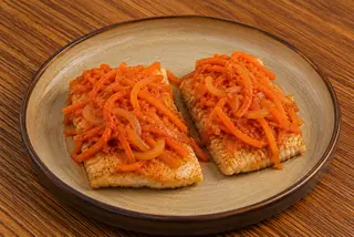 Hake in carrot marinade