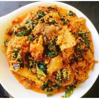 1 plate of Egusi Mixed with Bitterleaf Soup with swallow and Protein