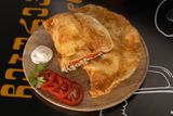 Cheburek with beef and tomatoes.
