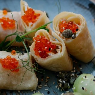 Crepe roll with salmon and red caviar