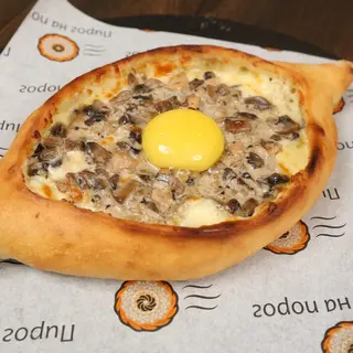 Khachapuri "Julienne" with  cheese, mozzarella and mushrooms