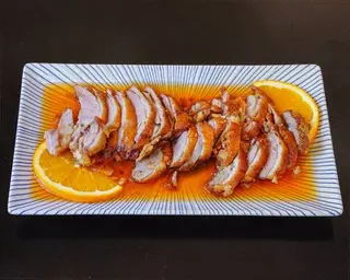 Pato Frito En Salsa De Naranja