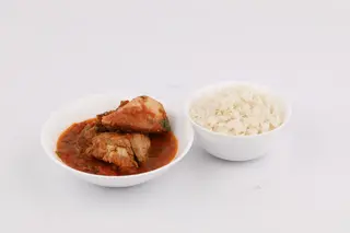 Chicken stew with rice and a side