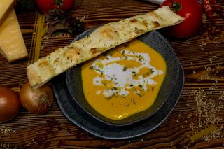 Pumpkin cream soup with pumpkin seeds and coconut paste