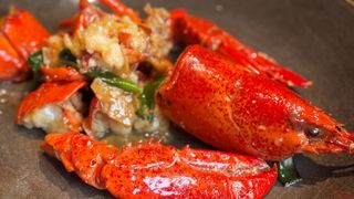 Astice allo zenzero e cipollotto