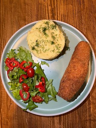 Chicken kiev with puree and salad
