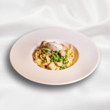 Tagliatelle with salmon and peas in cream sauce 
