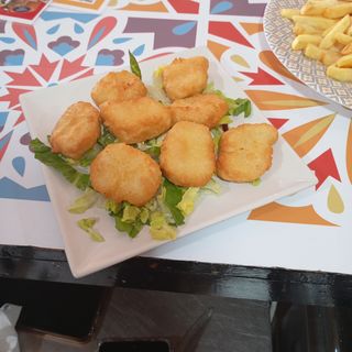 Cambo de Alitas Nuggets y Titas de pollo 