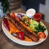 Portion of adana kebab