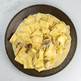 Ravioli con pollo e porcini