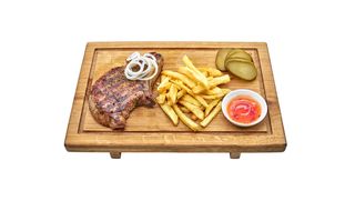 Стейк свинний з картоплею фрі та соусом (1шт)