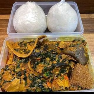 White Eba served with assorted goatmeat mixed with eforiro vegetables 