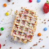 Belgian waffle , milk chocolate, sprinkles 