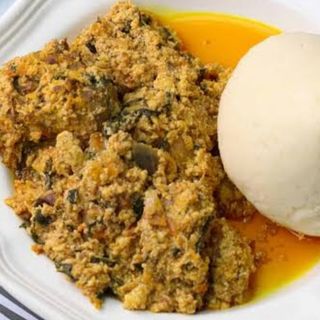 White ugali served with egusi mixed with beef