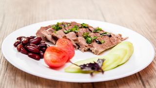 Boiled beef with red beans and fresh vegetables 