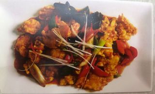 Жареная рыба с помидорами