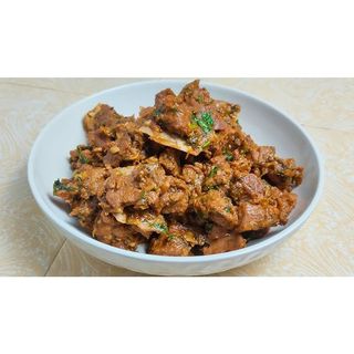 Fried goat with carrot and pepper