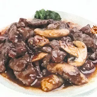 ternera con champiñones