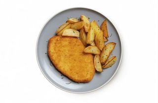 Cotoletta di pollo con patate al forno