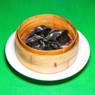 Ravioli di pesce al nero di seppia