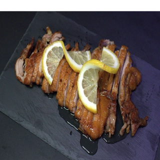 Pato asado con salsa de limón