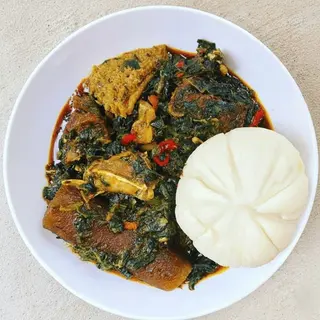 Vegetable Soup with Assorted Goat Meat & Swallow