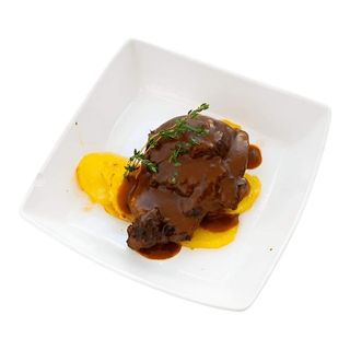 Carrilleras De Cerdo con piperrada