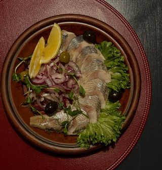 Оселедець з цибулею 250г