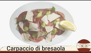 Carpaccio di bresaola con rucola,pesto di zucchine,grana