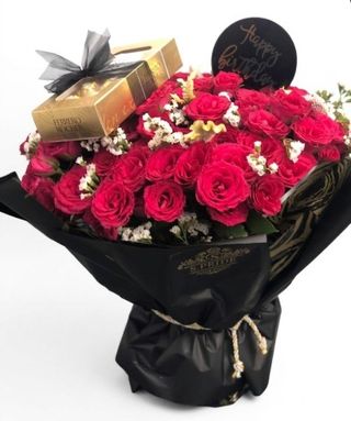 Beautiful red wroses and Ferero Rocher chocolate