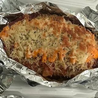 Papa gratinada con cheddar y bacon