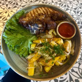Grilled pork steak with homemade potatoes