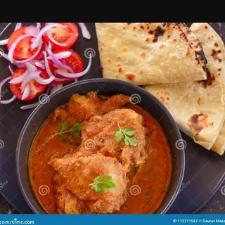 Chicken curry with roti and salad