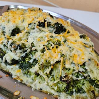 Ración De Brócoli Y Calabacín Gratinado