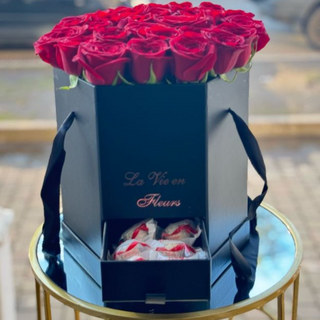 ყუთის კომპოზიცია წითელი ვარდებითა და რაფაელოთი