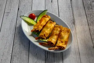 1A. Rollitos de langostinos con mango (4 uds.)