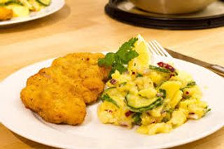 Cotoletta con contorno di patate 