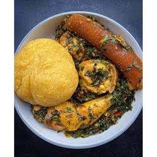 Efo riro and eba with meat and Kpomo