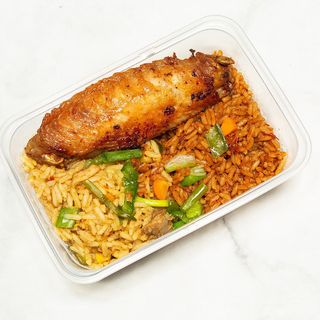 Half fried rice and half jollof rice with turkey