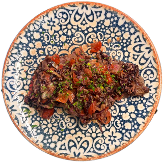 Tagliata di black angus con radicchio, pomodorini e gorgonzola