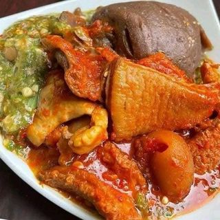 Amala served with okro mixed with shaki and pomo